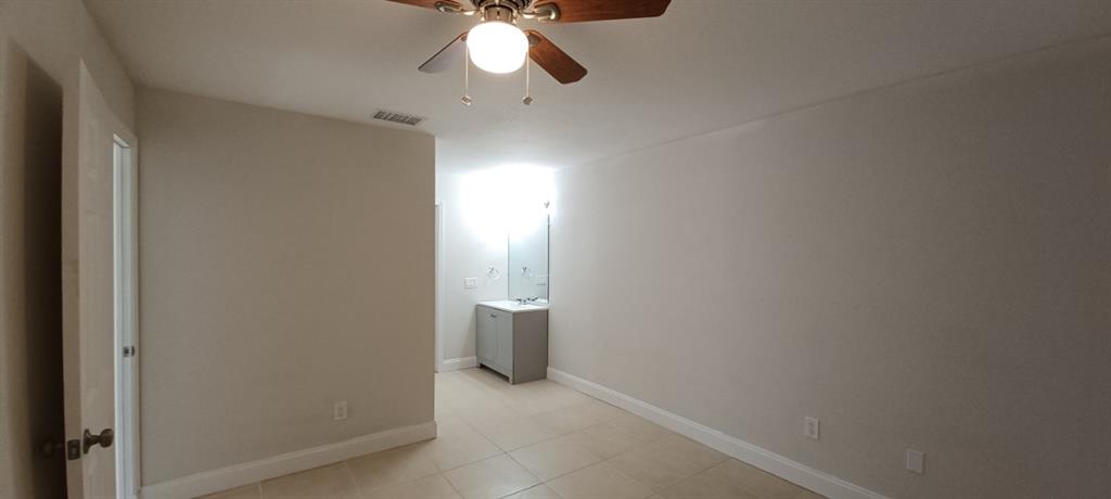 519 Southwest Sara Boulevard Port St. Lucie, FL 34953 - Photo 15 of 18 an empty room with a bathroom