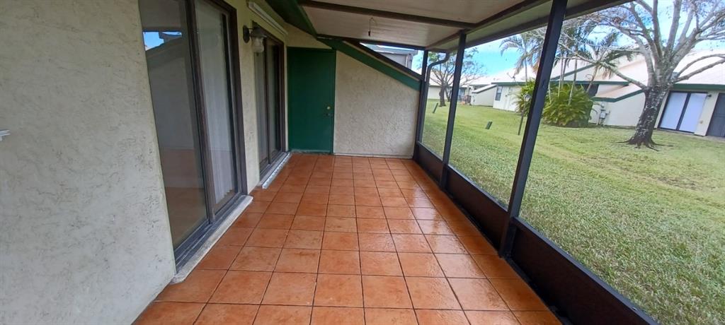 519 Southwest Sara Boulevard Port St. Lucie, FL 34953 - Photo 7 of 18 a view of a porch