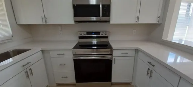 a view of staircase with white walls