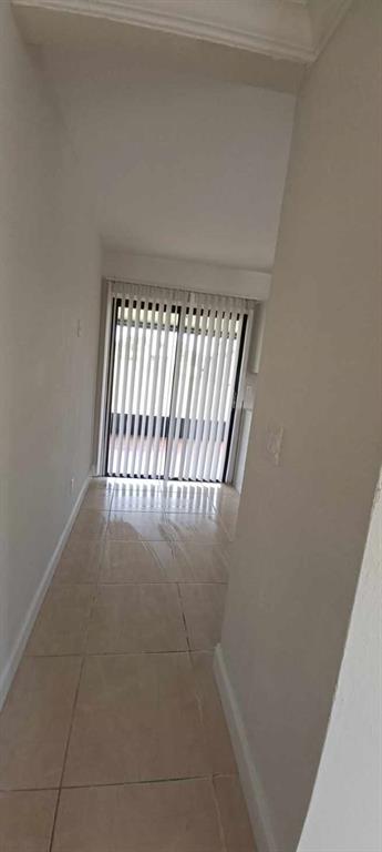 519 Southwest Sara Boulevard Port St. Lucie, FL 34953 - Photo 9 of 18 a view of staircase with white walls