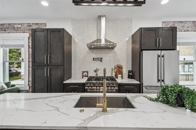 a kitchen with a refrigerator and a sink