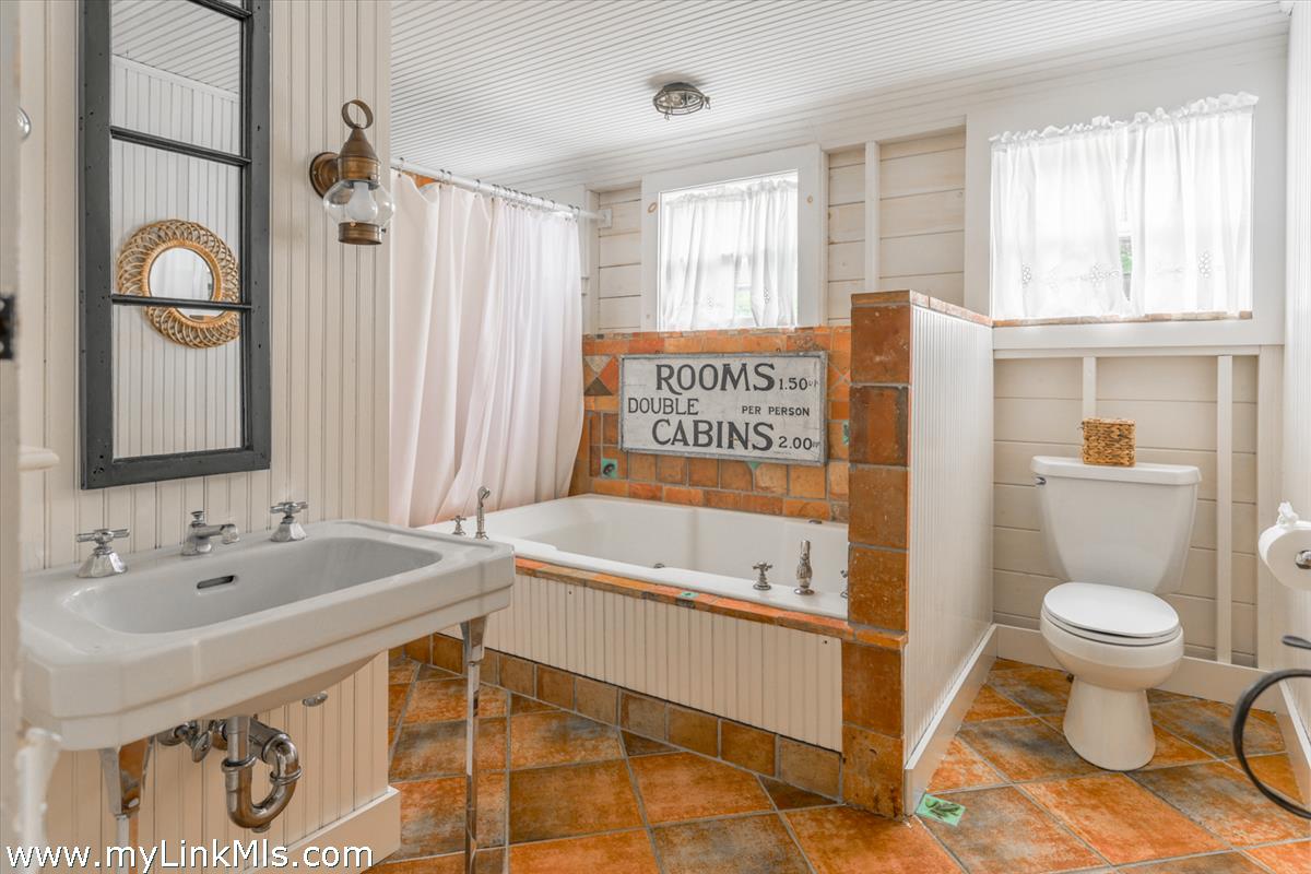 14 & 16 Coffin Street Nantucket, MA 02554 - Photo 39 of 50 a bathroom with a sink toilet and shower