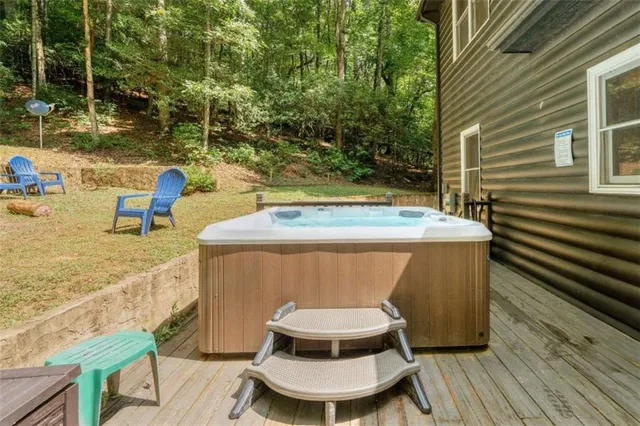 a view of a chairs and table on the deck