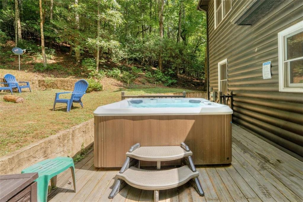 383 Canada Creek Road West Suches, GA 30572 - Photo 11 of 30 a view of a chairs and table on the deck