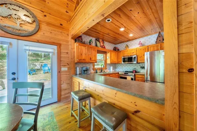 a large kitchen with a table and chairs in it