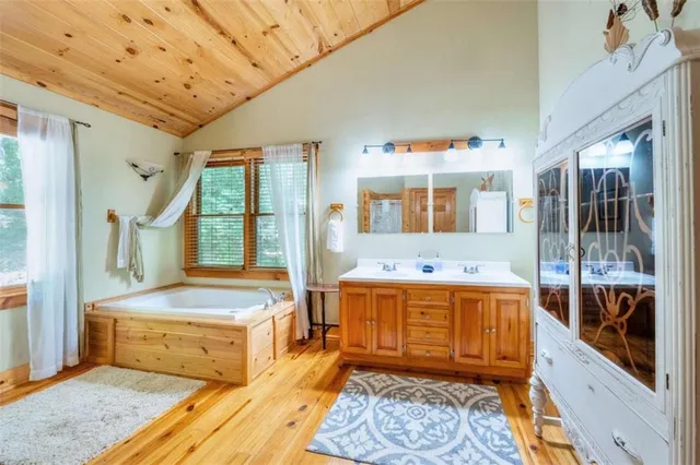 a room with a baby bed and dresser