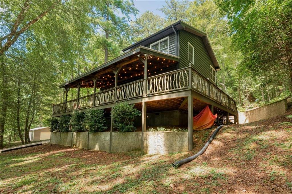 383 Canada Creek Road West Suches, GA 30572 - Photo 6 of 30 a view of a house with a small yard