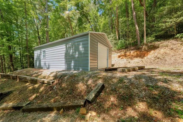 a backyard of a house with large trees