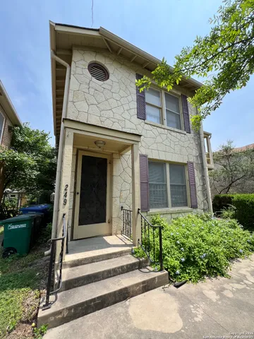 front view of a house with a small yard