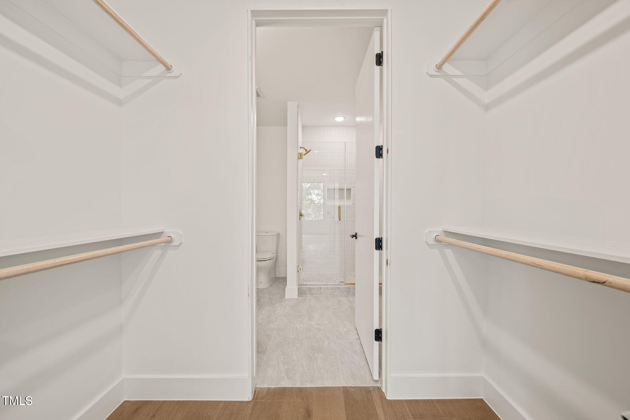 29 Enterprise Street, Unit 302 Raleigh, NC 27607 - Photo 5 of 36 a bathroom with a glass shower door