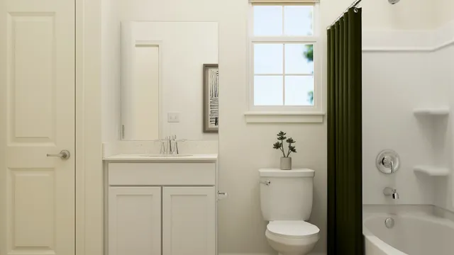 a bathroom with a sink a toilet and a window