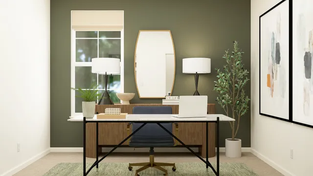 a view of a workspace room with furniture and window