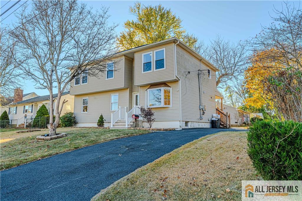 437 2nd Street Middlesex, NJ 08846 - Photo 2 of 66 a front view of a house with a yard