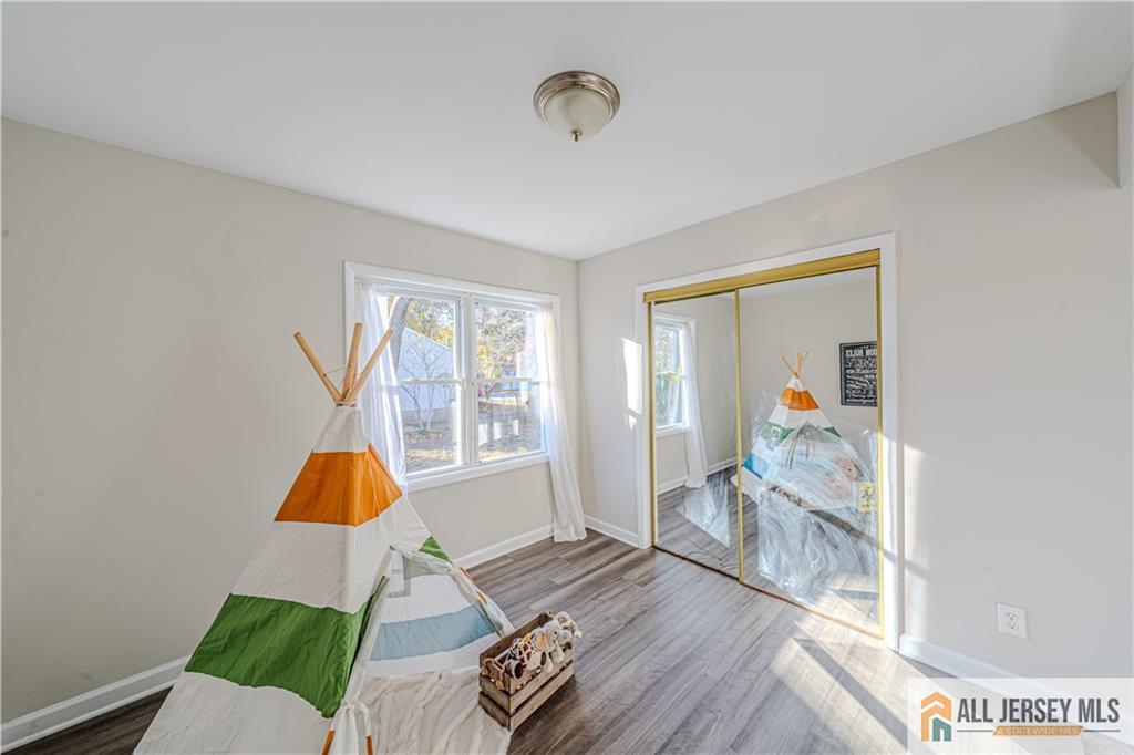 437 2nd Street Middlesex, NJ 08846 - Photo 30 of 66 a living room with furniture and a window