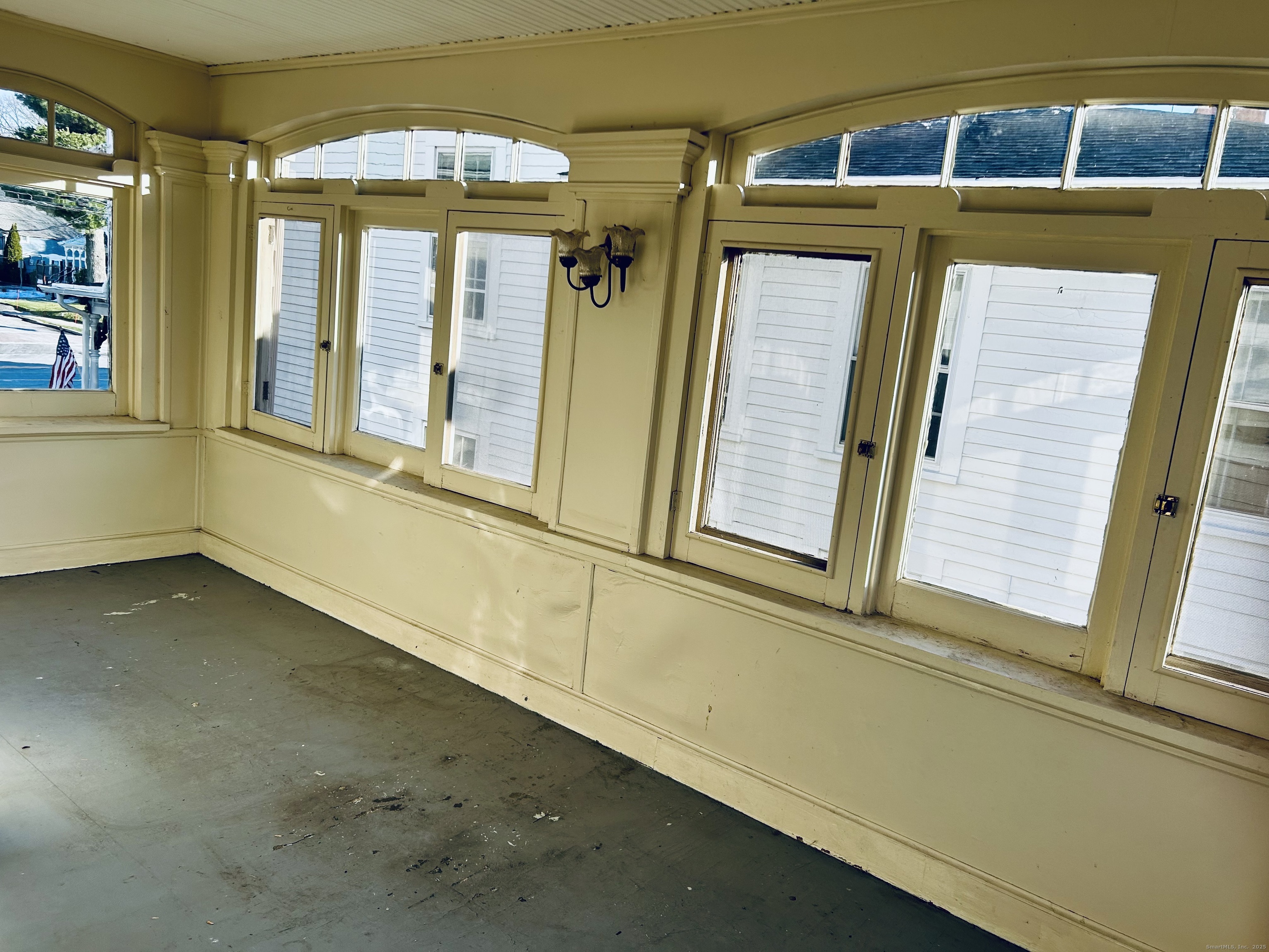 2247 Main Street, Unit 2 Glastonbury, CT 06033 - Photo 11 of 13 Side porch to unit overlooking the rear yard and River Front Park trail head.
