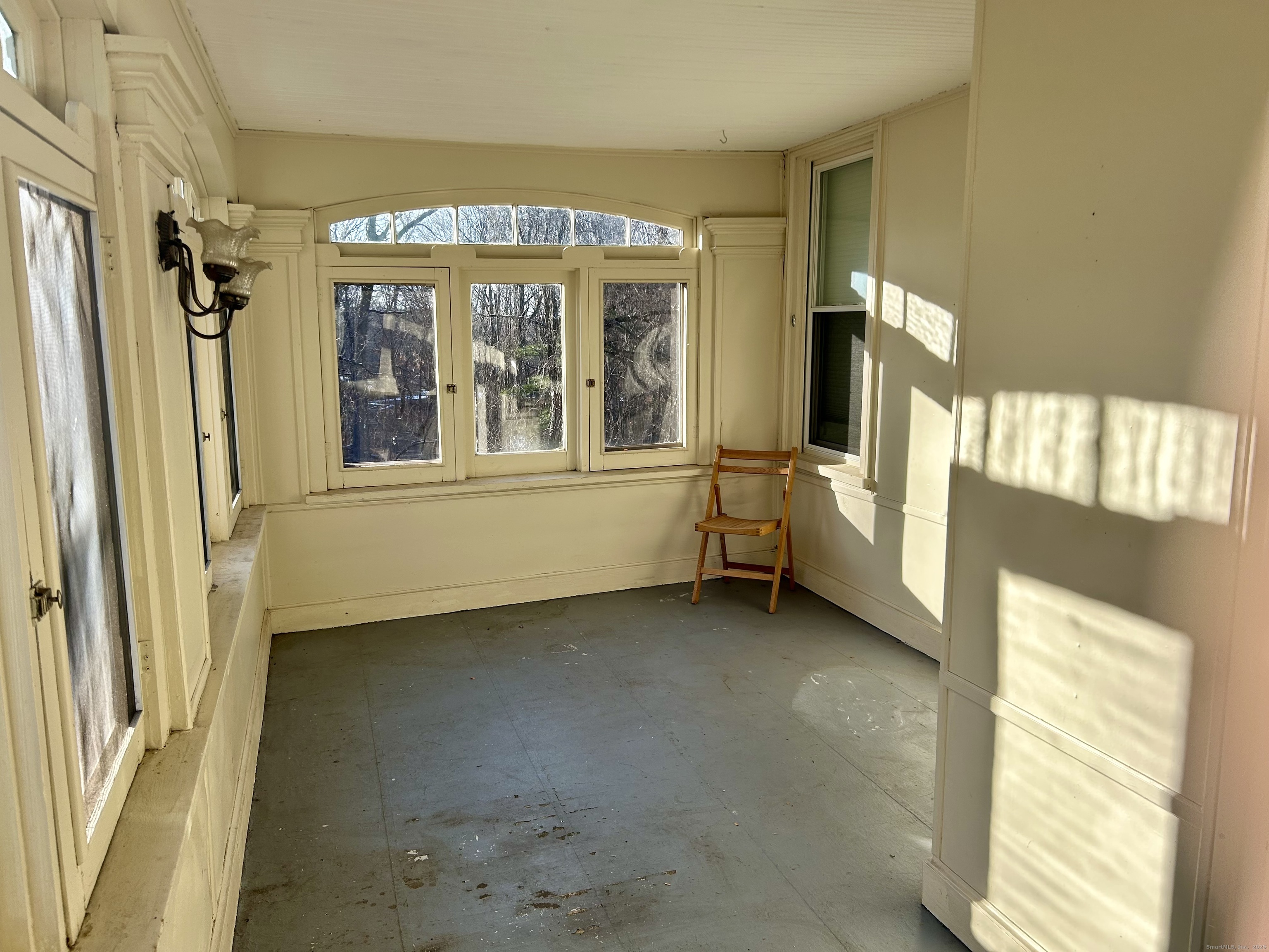 2247 Main Street, Unit 2 Glastonbury, CT 06033 - Photo 13 of 13 Side porch to unit overlooking the rear yard and River Front Park trail head.