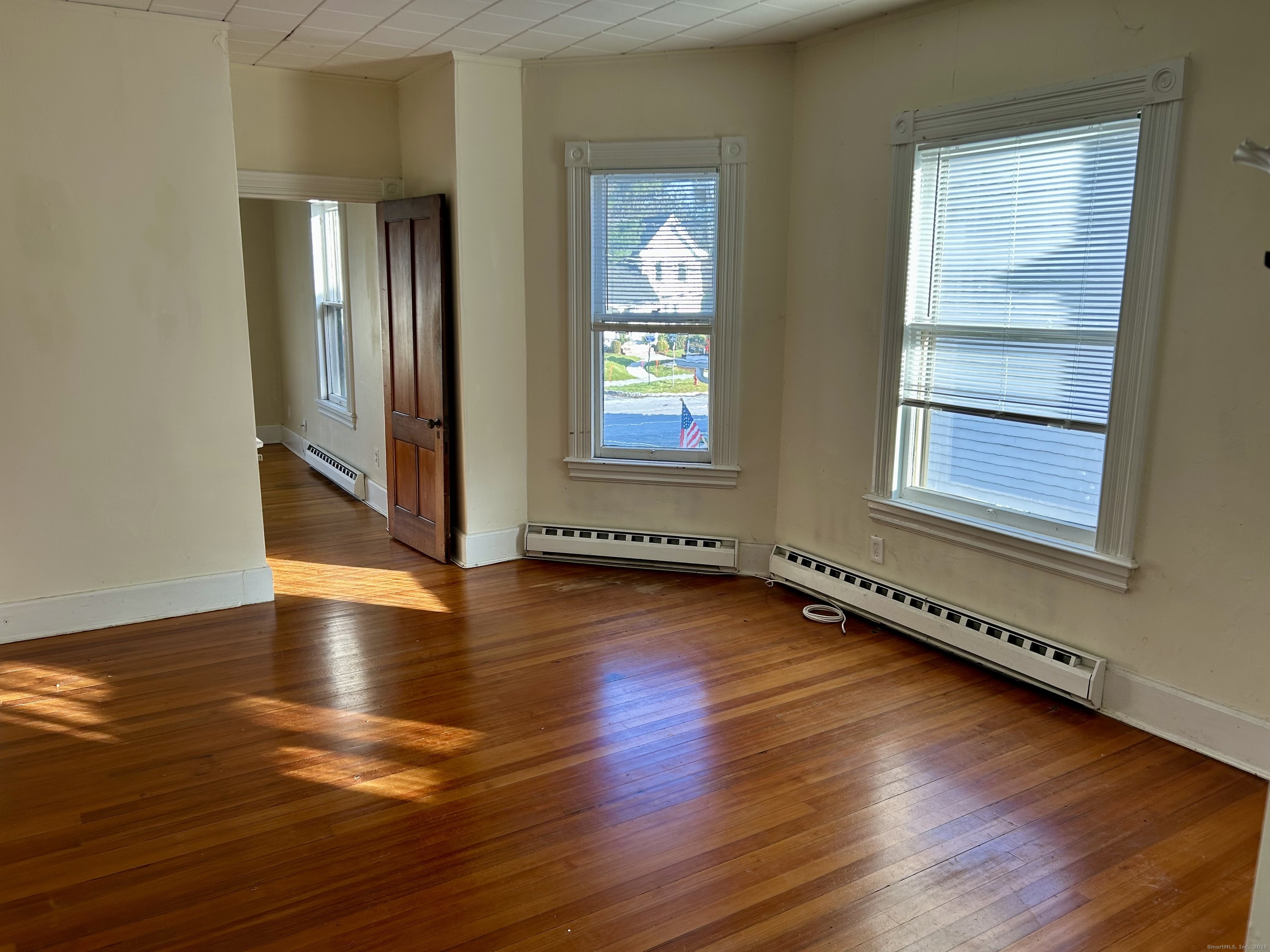 2247 Main Street, Unit 2 Glastonbury, CT 06033 - Photo 9 of 13 Bright, sunny and spacious living room.