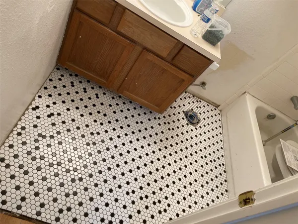 a bathroom with a sink and vanity