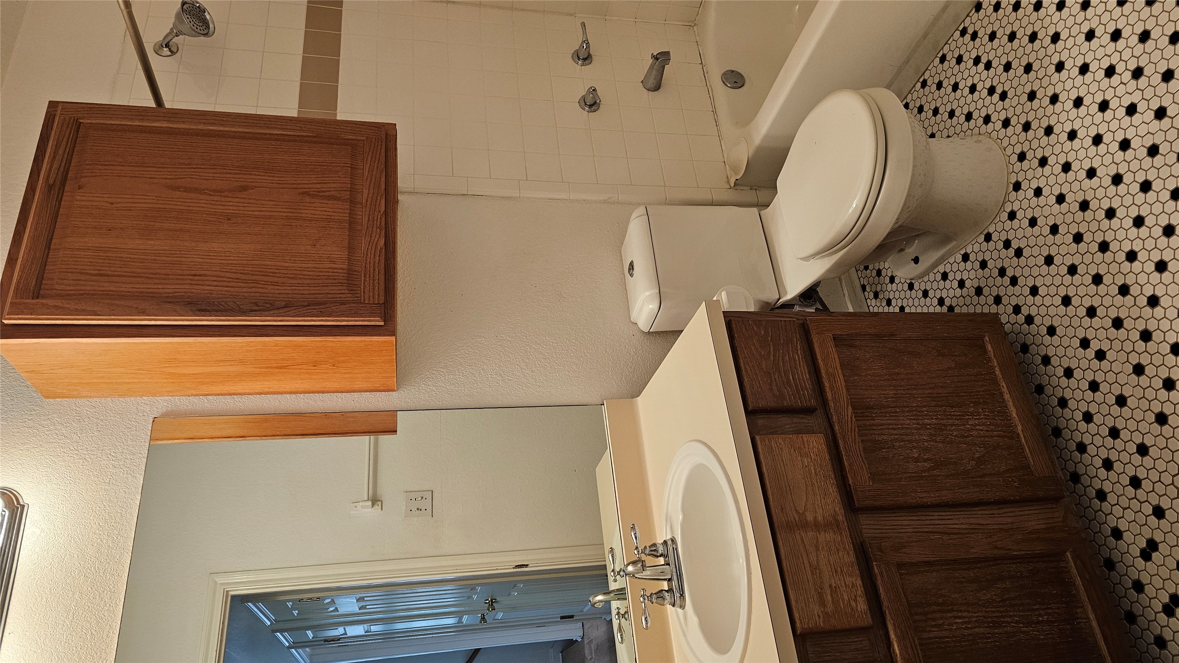 8010 Willet Trail, Unit A Austin, TX 78745 - Photo 18 of 31 a bathroom with a sink a toilet and shower