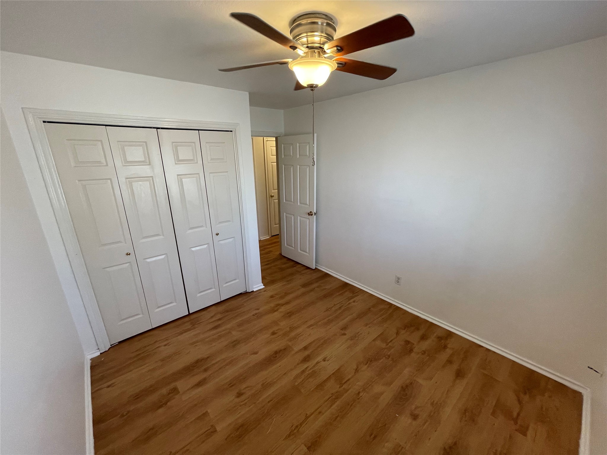 8010 Willet Trail, Unit A Austin, TX 78745 - Photo 21 of 31 wooden floor in an empty room