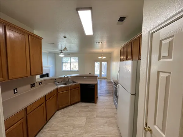 a large kitchen with a lot of counter space