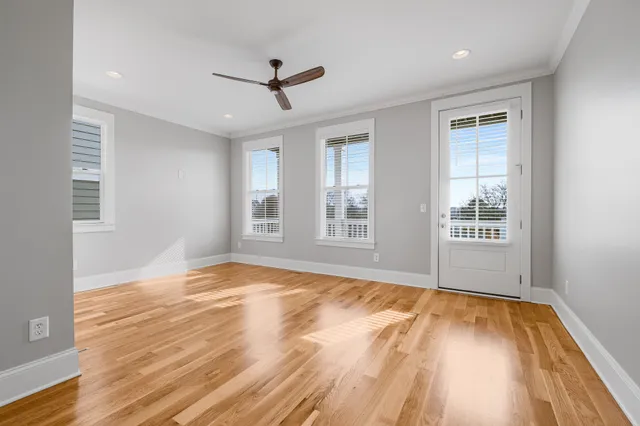 a view of a balcony with wooden floor