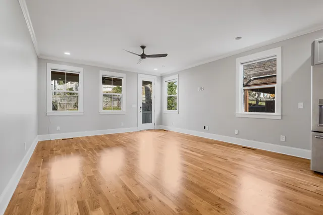 a view of walk in closet with empty racks