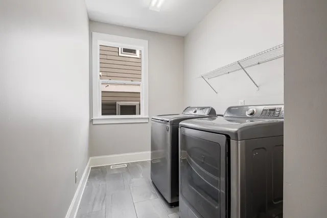 a spacious bathroom with a granite countertop sink a mirror and a shower