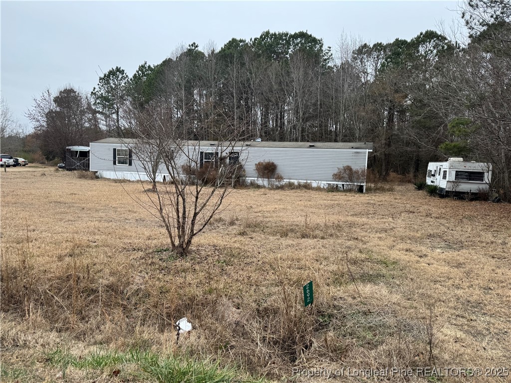 2692 Jonesville Road Fairmont, NC 28340 - Photo 9 of 9 a view of a house with a yard