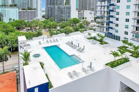 a view of a lobby with furniture and floor to ceiling window