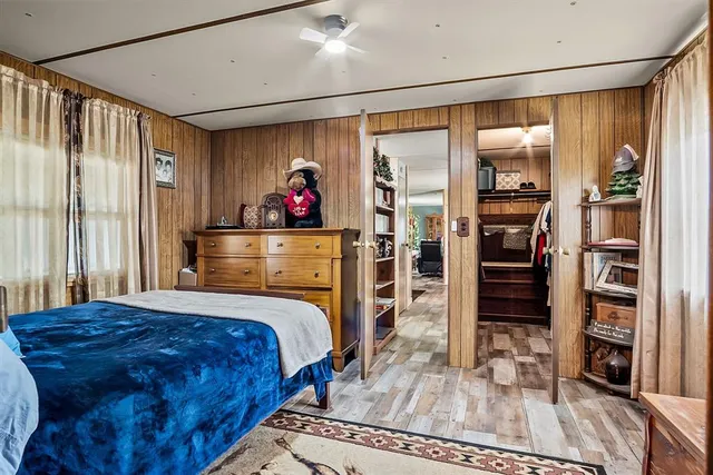 a bedroom with a bed and a walk in closet