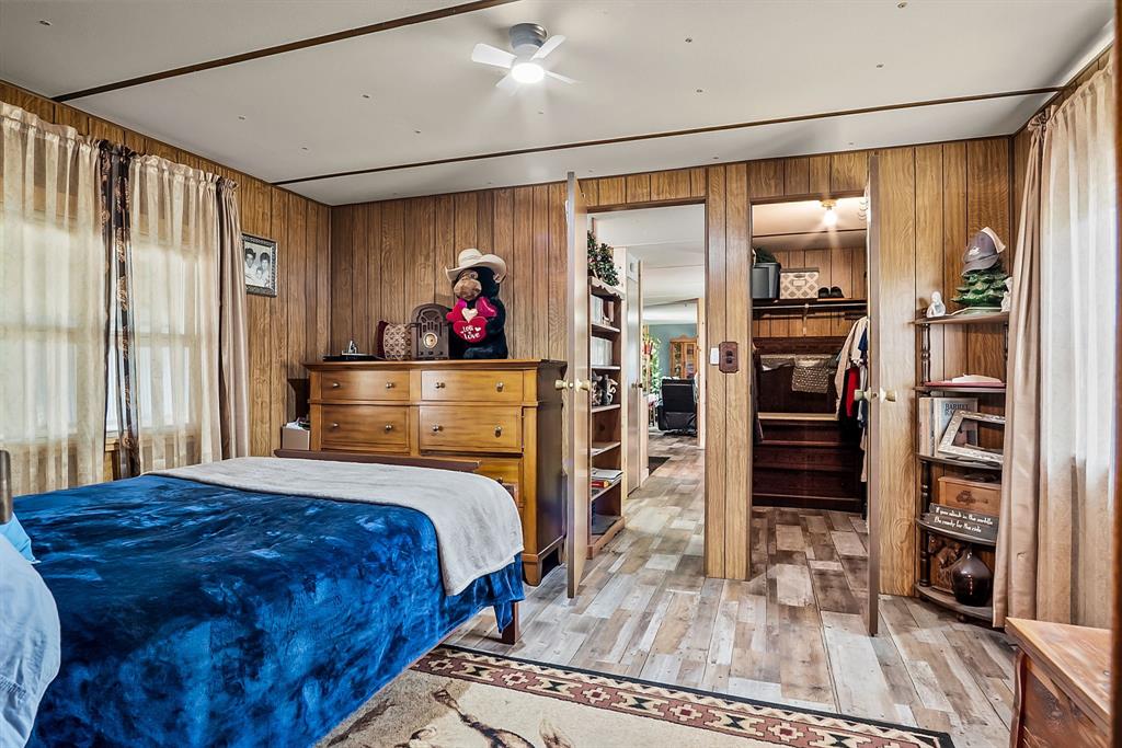 87 Ledbetter Road Mineral Wells, TX 76067 - Photo 12 of 22 a bedroom with a bed and a walk in closet