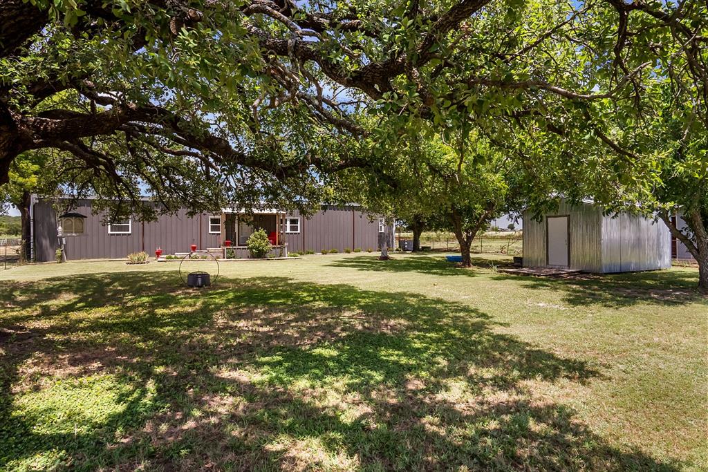 87 Ledbetter Road Mineral Wells, TX 76067 - Photo 17 of 22 a front view of a house with a yard