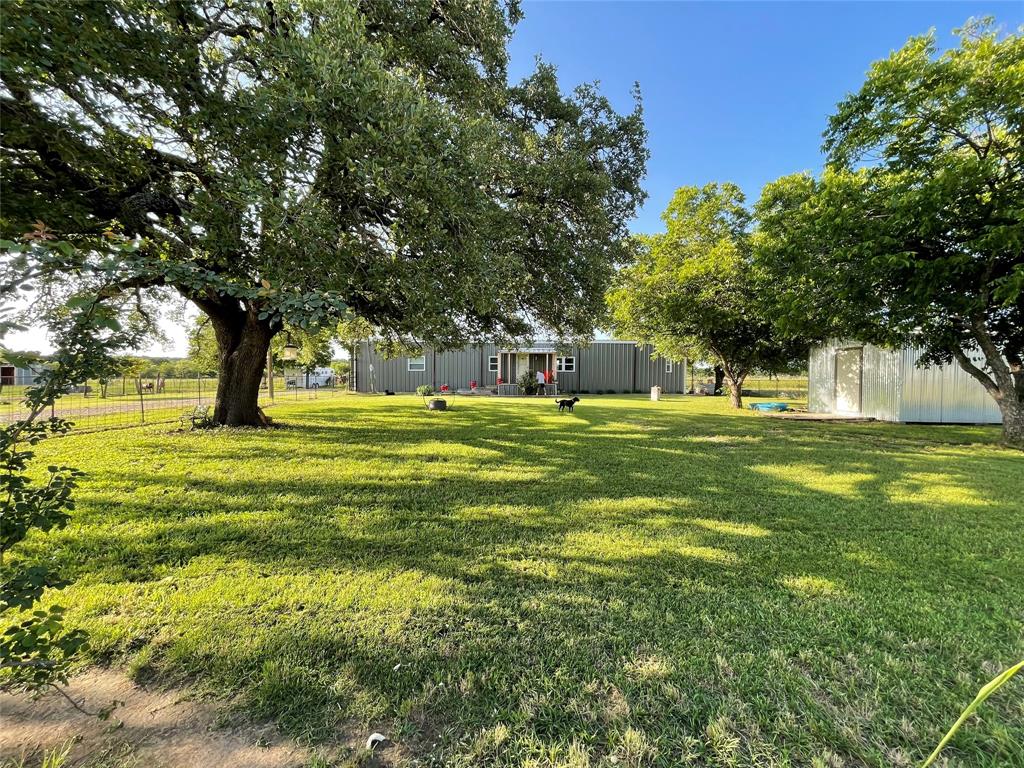 87 Ledbetter Road Mineral Wells, TX 76067 - Photo 22 of 22 a view of a trees in a yard