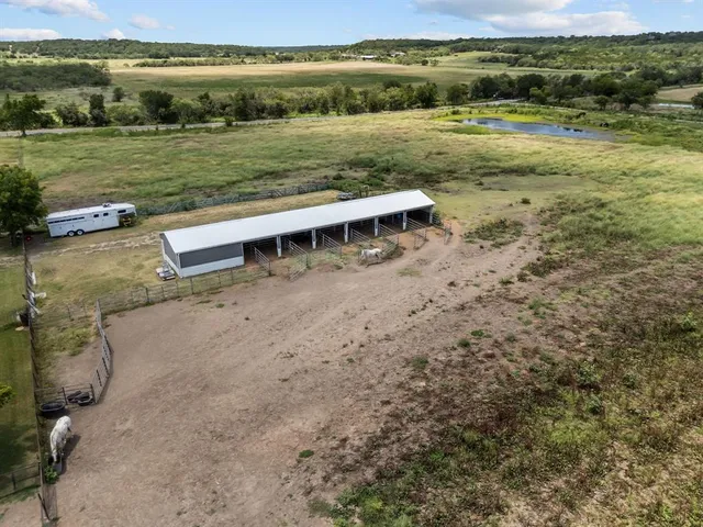 a view of yard with ocean and trees