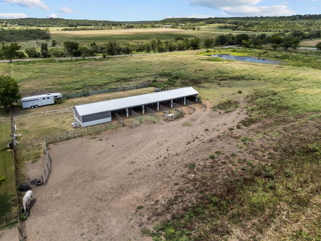 87 Ledbetter Road Mineral Wells, TX 76067 - Photo 4 of 22 a view of yard with ocean and trees