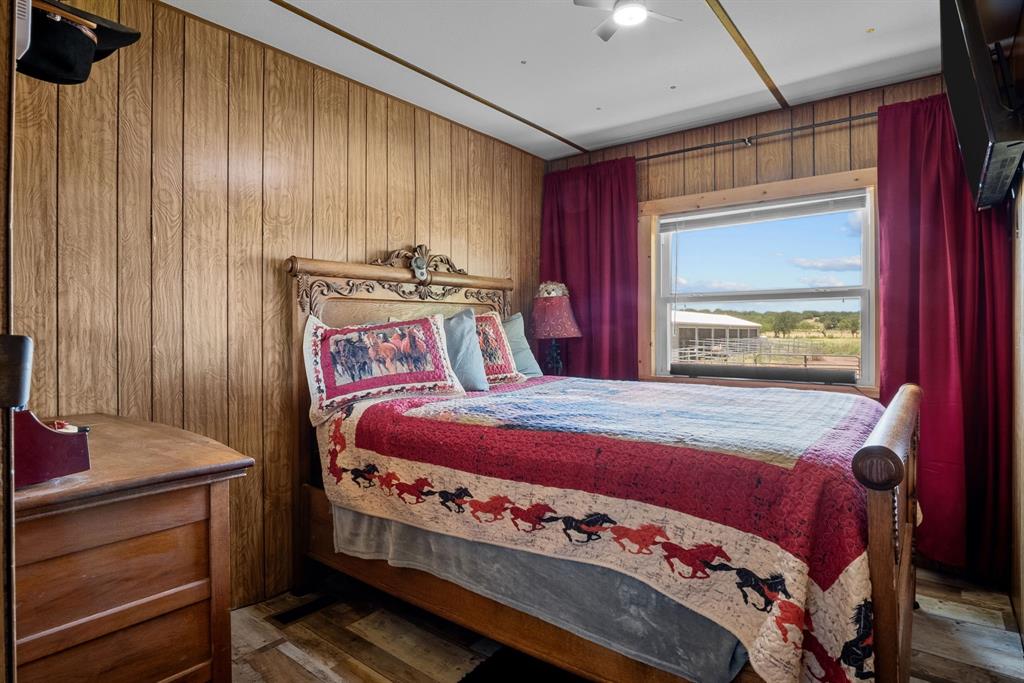 87 Ledbetter Road Mineral Wells, TX 76067 - Photo 10 of 22 a bedroom with a bed and a window