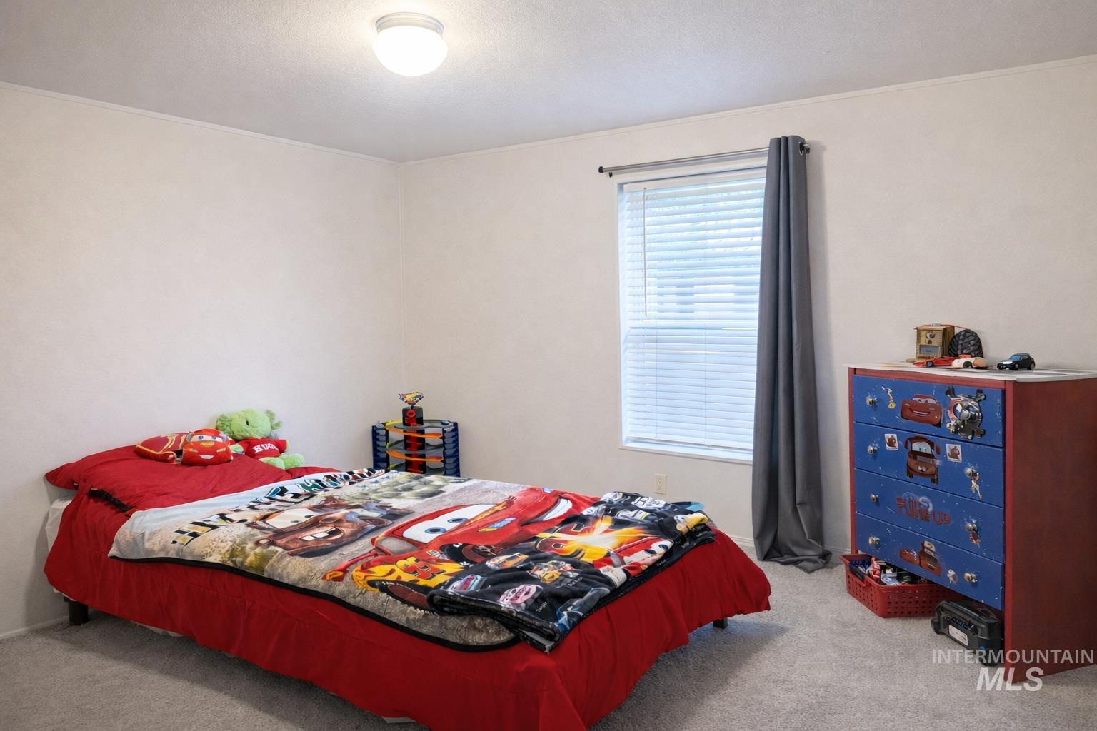 700 East Fairview Avenue, Unit 195 Meridian, ID 83642 - Photo 15 of 19 Bedroom with light colored carpet