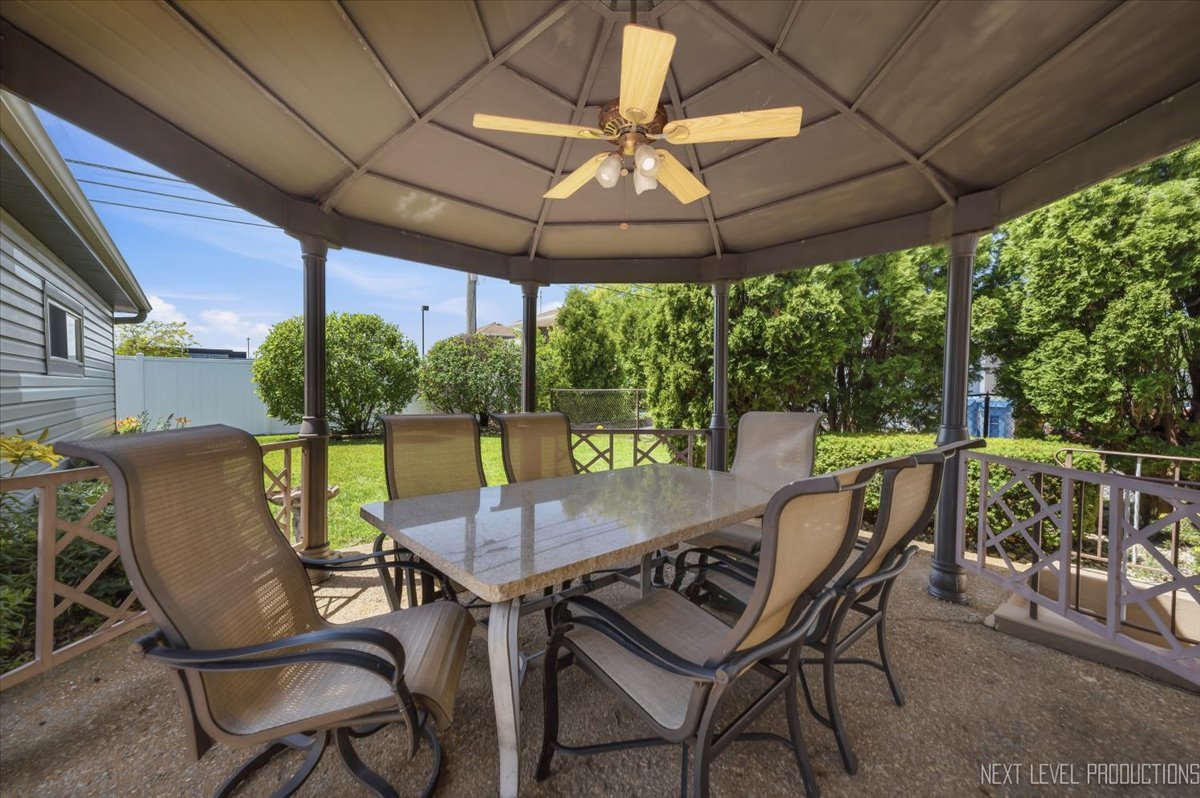 754 North Michigan Street Elmhurst, IL 60126 - Photo 25 of 32 a view of a patio with a table chairs and a backyard