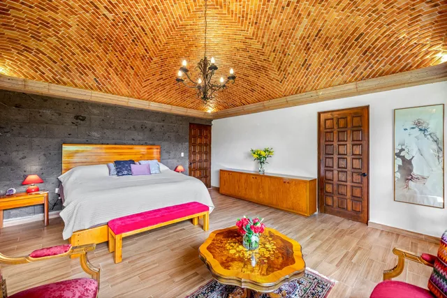 a living room with dining room and wooden floor