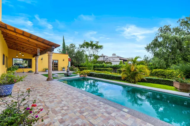 a view of a swimming pool with a patio