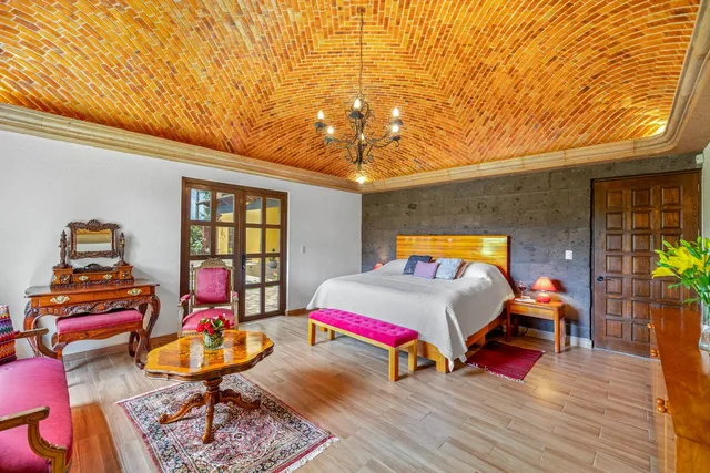 a bedroom with bed and window