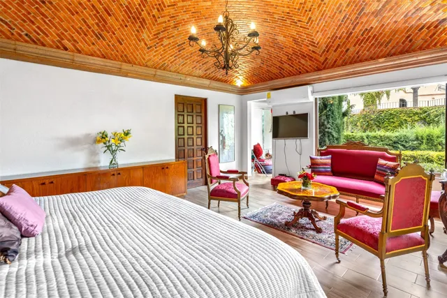 a balcony with furniture and wooden floor