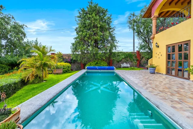 a view of swimming pool with a yard