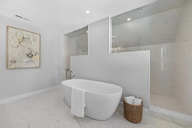 a white bath tub sitting in a bathroom