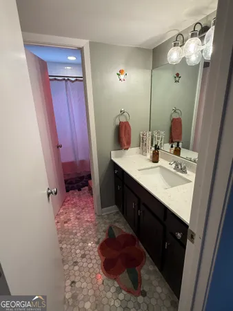 a bathroom with a sink a vanity and a mirror