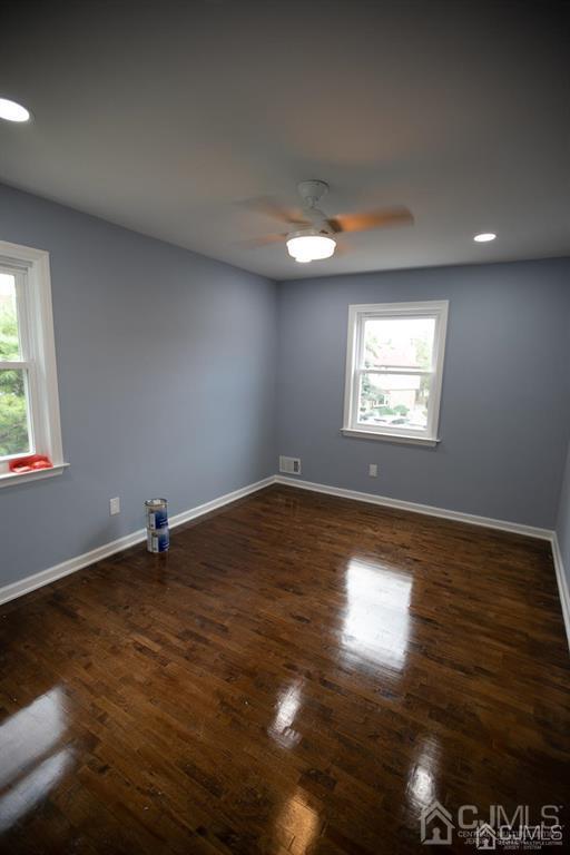 4208 Hana Road Edison, NJ 08817 - Photo 10 of 34 an empty room with wooden floor and windows