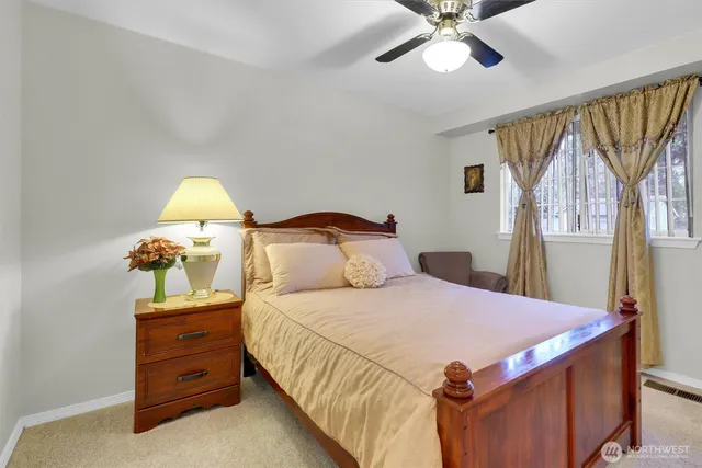 a bedroom with a bed and a dresser