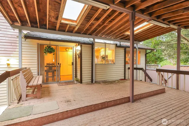 a view of porch with wooden floor and furniture