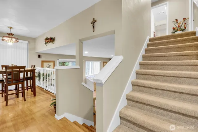 a view of entryway and hall with dining room